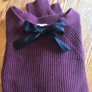 Maroon sweater with black ribbon accent